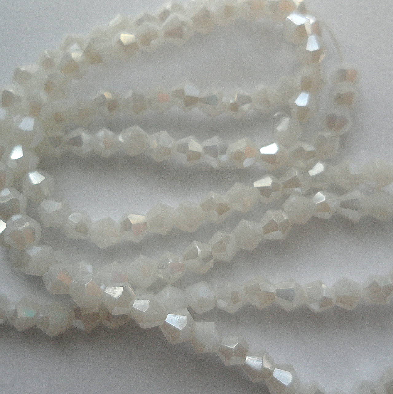 CrystaLine Beads™/bicone 3mm-1ks (solid white AB)
