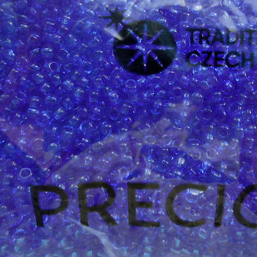 Rokajl 11/0 PRECIOSA 2mm TRANSP-10g (modrá kobalt)