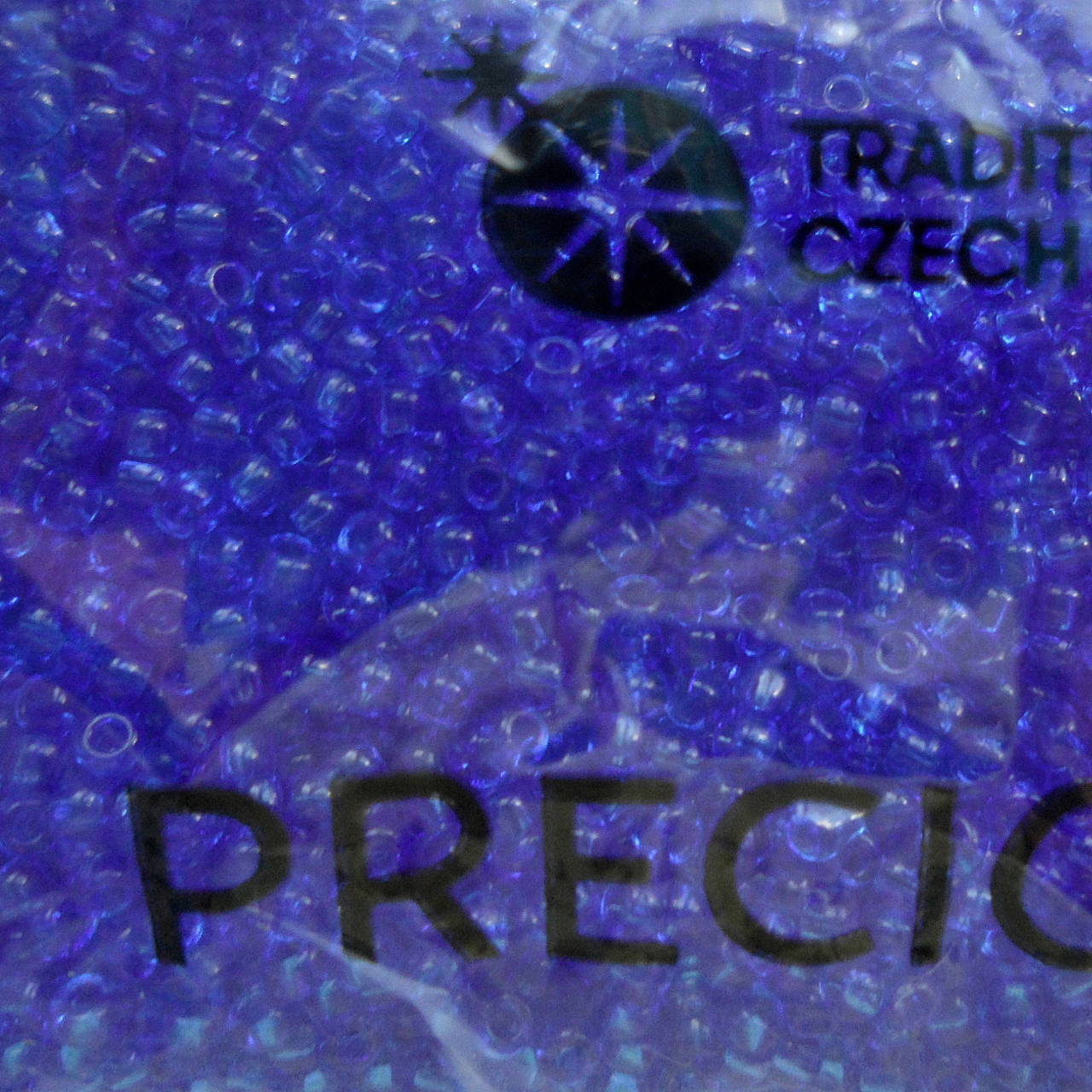 Rokajl 11/0 PRECIOSA 2mm TRANSP-10g (modrá kobalt)