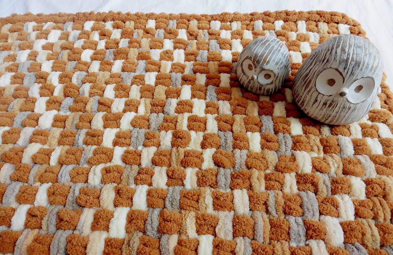 Jemný a ľahučký prepletaný koberček