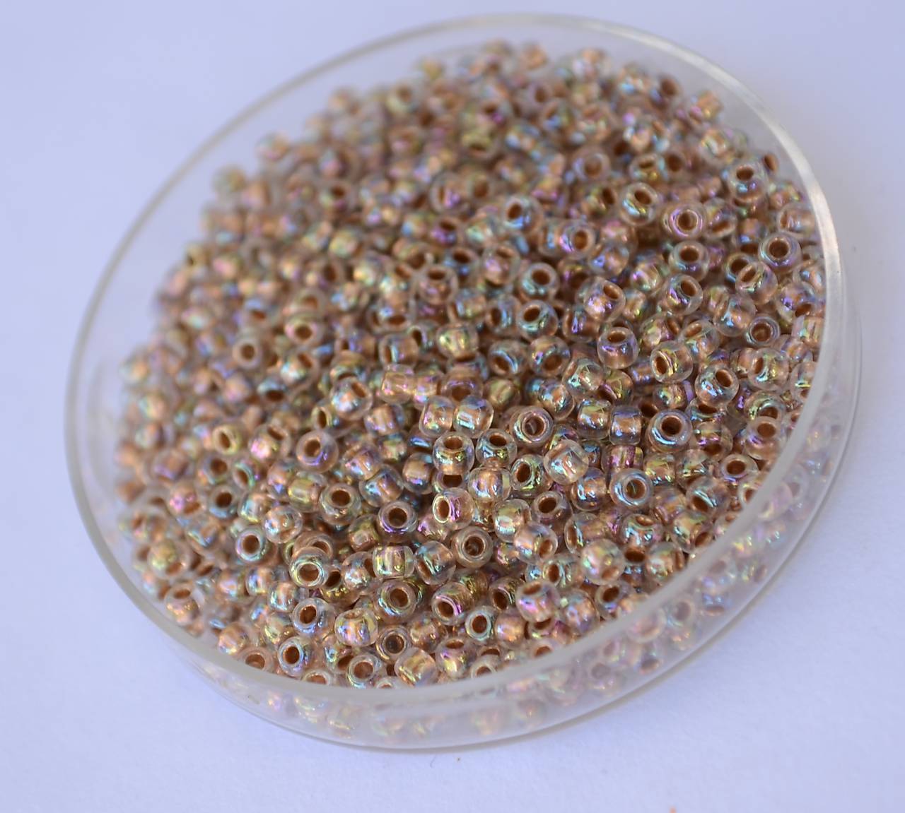 Toho Gold-Lined Rainbow Crystal 11/o, 25+5g