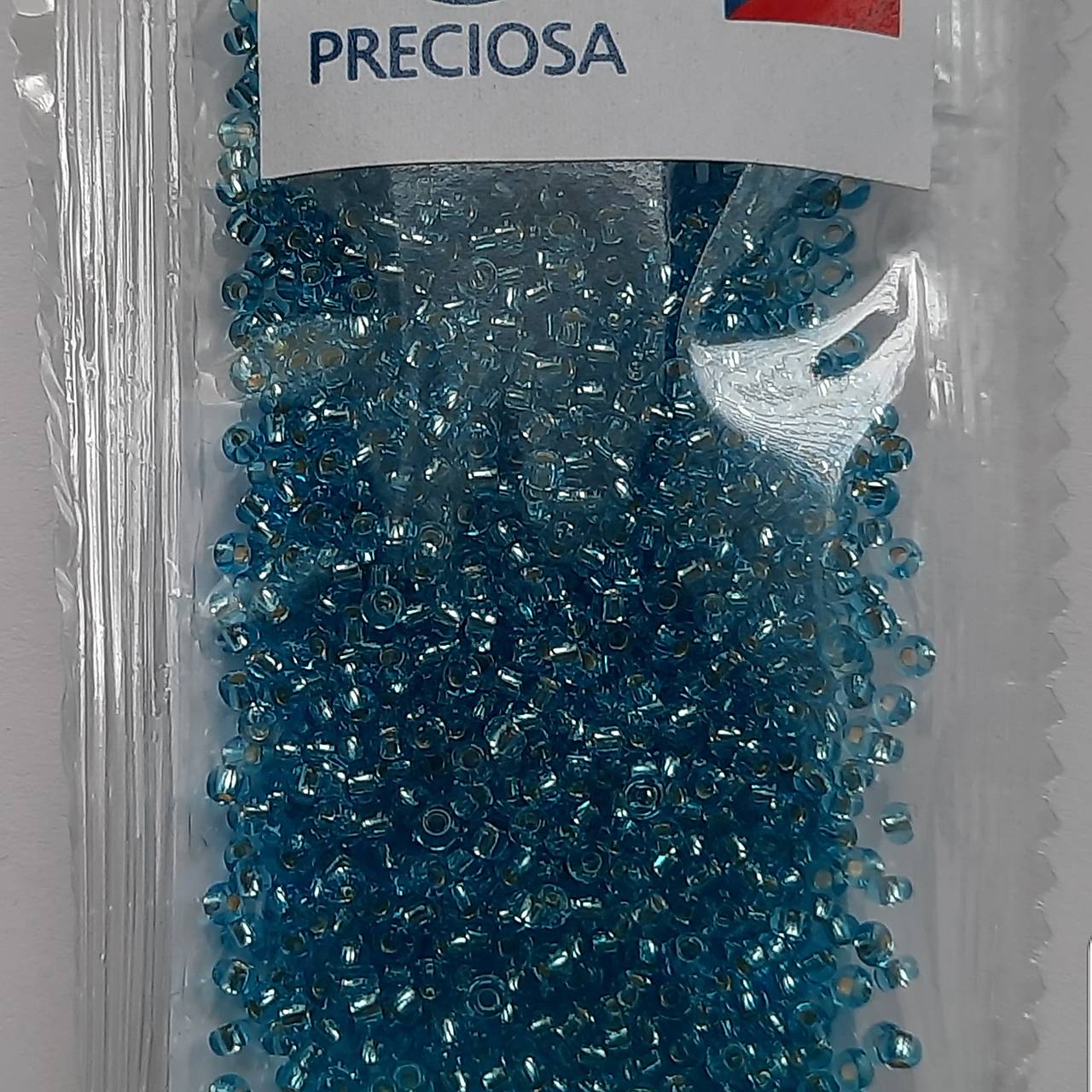 Rokajl 10/0 PRECIOSA 2,3mm s prieťahom-10g (modrá azuro)