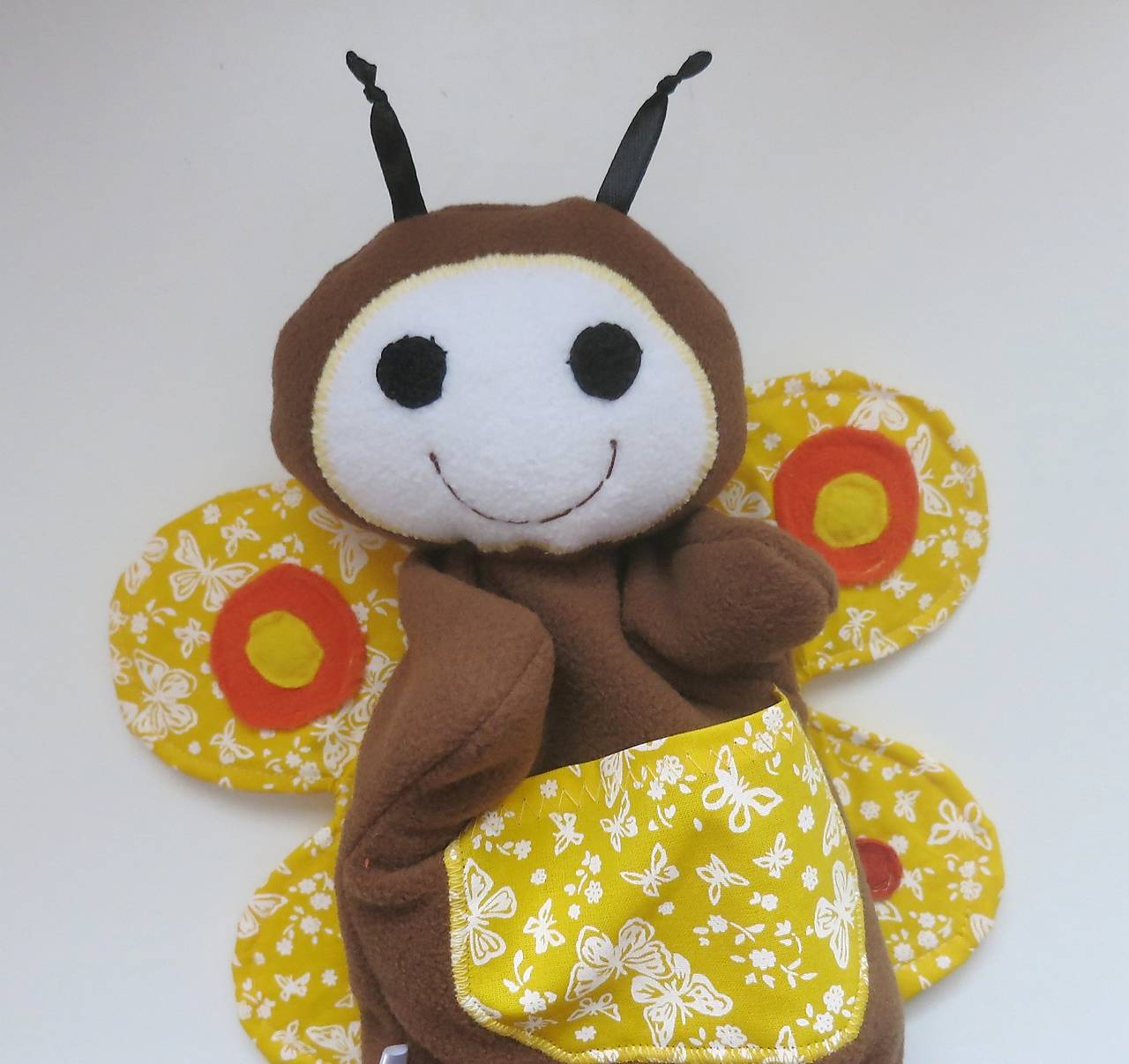 Maňuška motýľ (Hnedý so žltými krídlami)