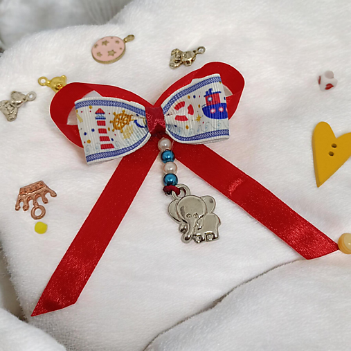 Stužka (mašlička) proti urieknutiu na kočík s príveskom