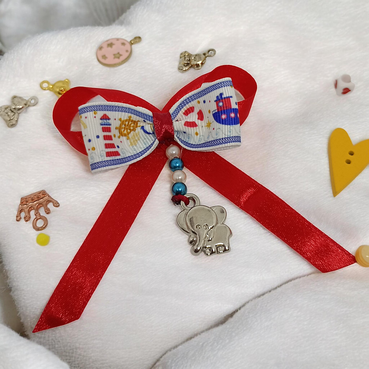 Stužka (mašlička) proti urieknutiu na kočík s príveskom