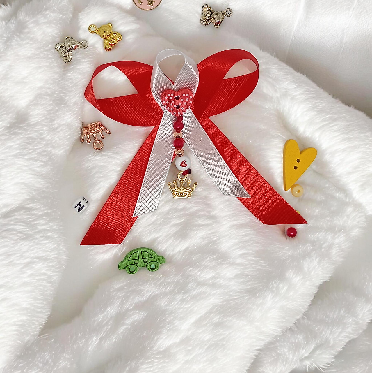 Stužka (mašlička) proti urieknutiu na kočík s príveskom